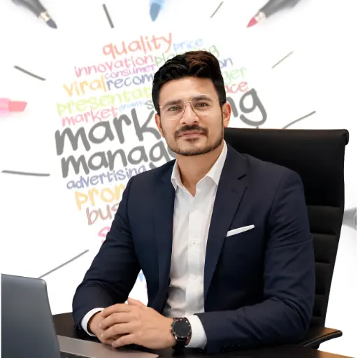 Rohit Upadhya, founder of Digitophile digital marketing agency in Siliguri, sitting at a desk in a blue suit jacket with a marketing strategy typography graphic background